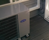 Slim AC Condenser Unit on Patio with Aesthetic Line-Set Covering on Wall